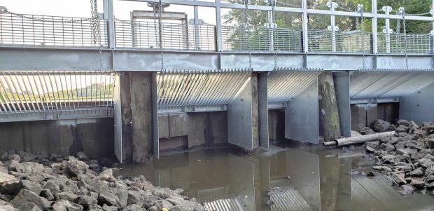 Image slide of Ferric chloride weir with new carp barrier and maintenance deck.
